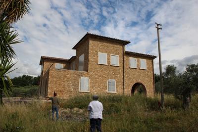 Unfinished farmhouse with olive grove